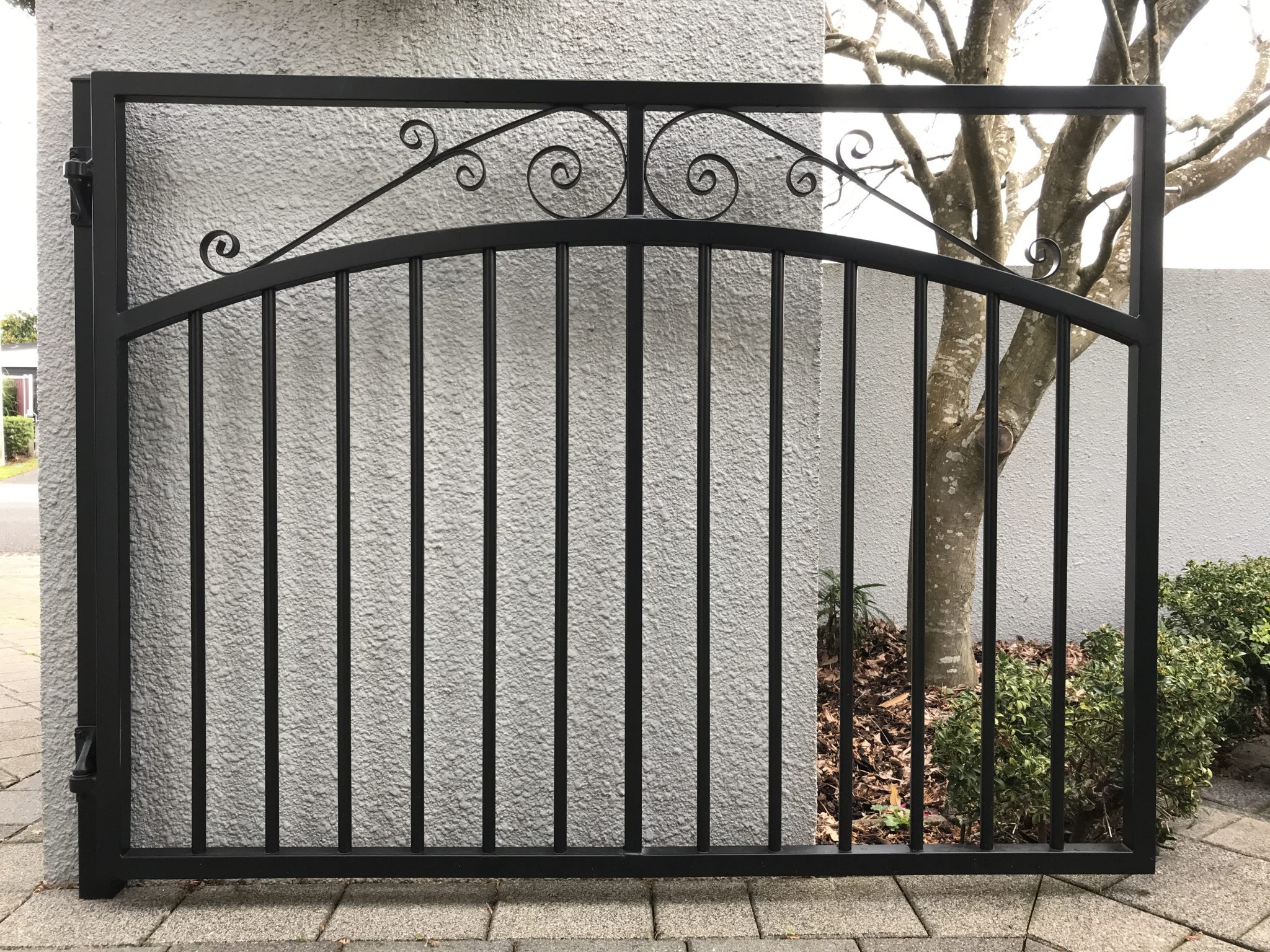 person pedestrian gate black bars with scroll for the home
