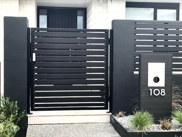 modern stylish front gate in horizontal black slats