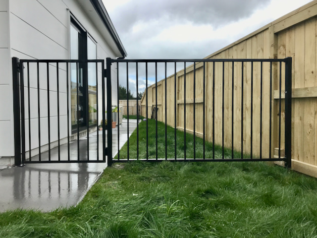 black metal bar fence with gate for home