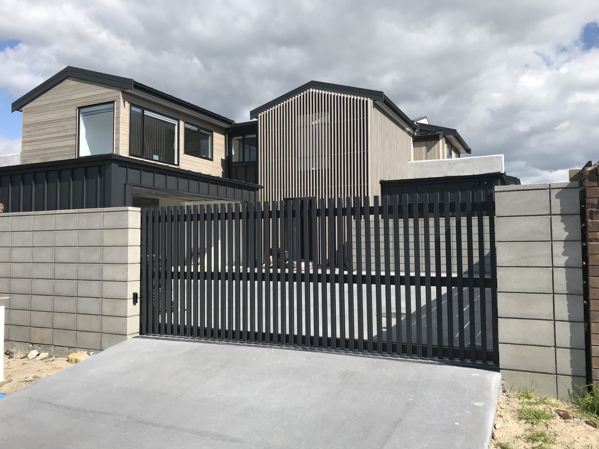 sliding gate black slats modern style