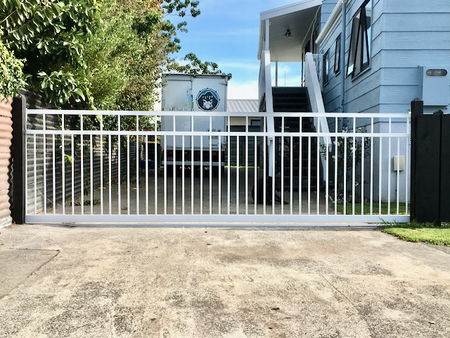 white sliding metal bar gate for drive way cars